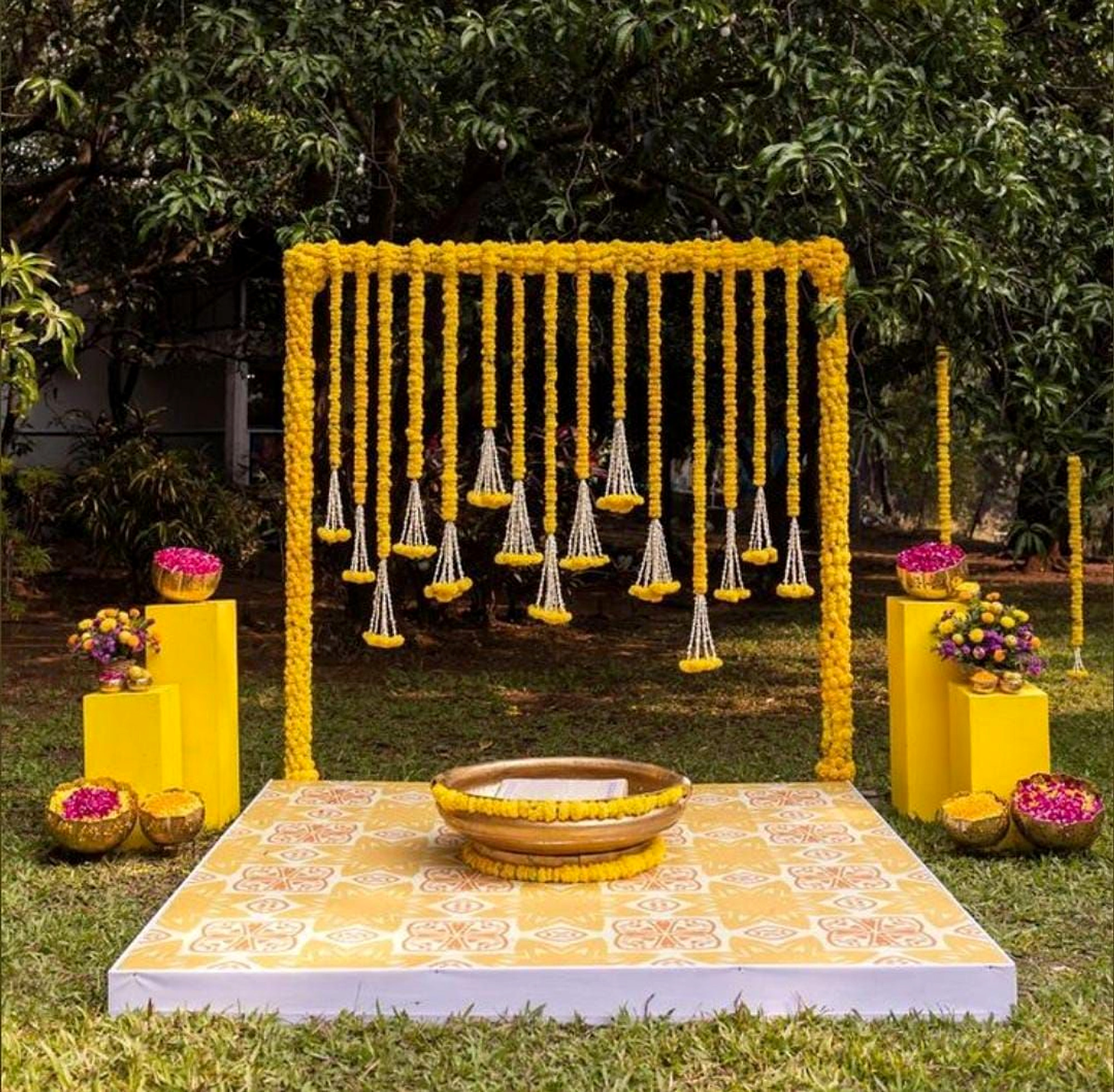Traditional Outdoor Ceremony Decor With Yellow Marigold Flowers And Floral Backdrop - balloon and flower decoration by Happy Balloons thumbnail 2